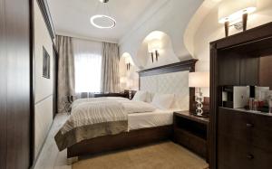 Posteľ alebo postele v izbe v ubytovaní Hotel Grand