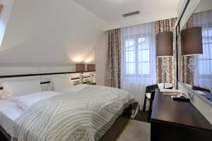 Posteľ alebo postele v izbe v ubytovaní Hotel Grand