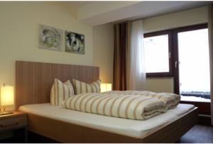 Postel nebo postele na pokoji v ubytování Hotel Garni Bernadette