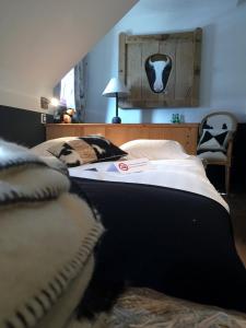 Letto o letti in una camera di Hostellerie de Genève