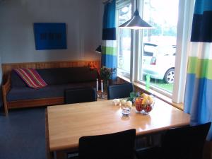 a living room with a table and a couch at Ystad Camping in Ystad