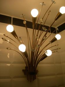 a large vase with lights on a ceiling at La Fermette de la Vache Rousse in Rosult