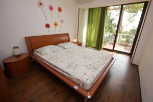 Postel nebo postele na pokoji v ubytování Apartments Nadia
