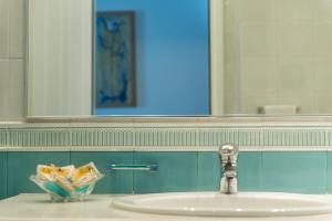 A bathroom at Poseidon Hotel Suites