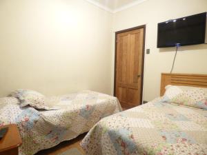 Postel nebo postele na pokoji v ubytování Hotel Vista Hermosa 17
