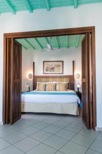 A bed or beds in a room at Poseidon Hotel Suites