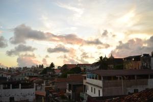 a view of a city with a cloudy sky at Salvador Dance-Hall Cuartos Privados in Salvador