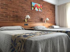 Costanera Mar Hotel & Suites 객실 침대