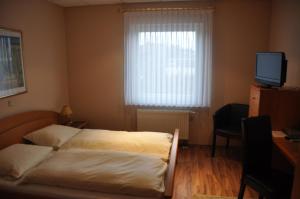 Voodi või voodid majutusasutuse Hotel Neuzeit toas