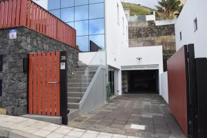 a building with a red door and a tunnel at Villa Cristal in La Orotava