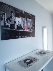 a black and white photo of a man standing in a kitchen at Apartment Arena Silver in Belgrade