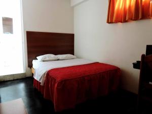 Posteľ alebo postele v izbe v ubytovaní Hostal Miramar