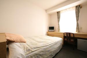Postel nebo postele na pokoji v ubytování Nagano Plaza Hotel