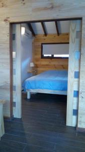 Postel nebo postele na pokoji v ubytování Lackuntur Pucón departamentos