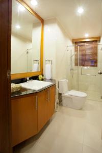a bathroom with a toilet and a sink and a shower at Villa with private pool in Hua Hin