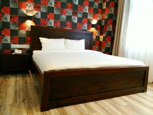 Postel nebo postele na pokoji v ubytování Wifi Boutique Hotel