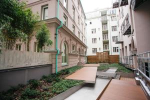 an empty alley in a city with buildings at Luxury apartment Spálená in Prague