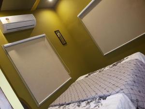 Ένα ή περισσότερα κρεβάτια σε δωμάτιο στο Belen - Service Apartment