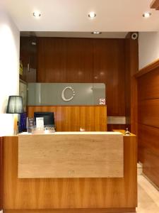 an office with a reception desk with a computer on it at Hotel Calasanz in Molins de Rei