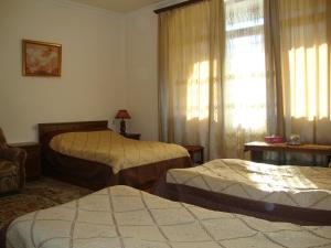 Postel nebo postele na pokoji v ubytování Hotel MIRA