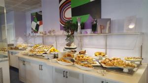 a buffet with many different types of food on a table at Aurea Hotel in Tortoreto Lido
