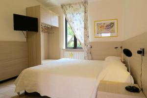 Letto o letti in una camera di Albergo Visconti