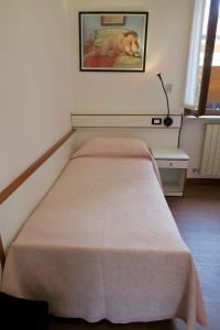 Letto o letti in una camera di Albergo Visconti