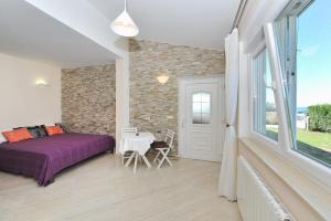 Postel nebo postele na pokoji v ubytování Apartments Dominique