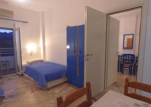 Postel nebo postele na pokoji v ubytování Helios Studios & Apartments