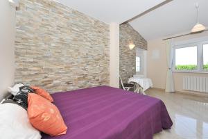 Postel nebo postele na pokoji v ubytování Apartments Dominique