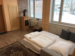 Postel nebo postele na pokoji v ubytování DNM Inn