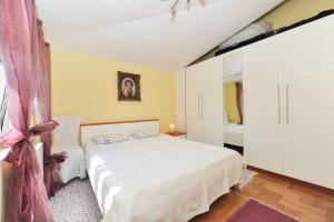 Postel nebo postele na pokoji v ubytování Apartments Dominique