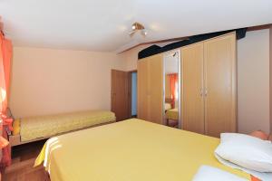 Postel nebo postele na pokoji v ubytování Apartments Dominique
