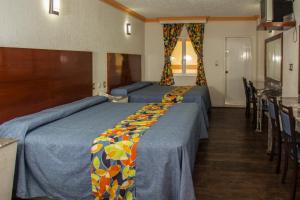 A bed or beds in a room at Las Avenidas