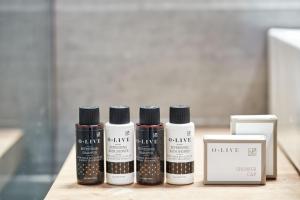a group of four products sitting on a table at Angelina Boutique Escape in Perdika