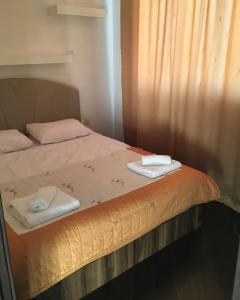 Кровать или кровати в номере Welcome Baku Apartment