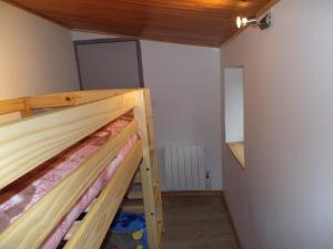 a bedroom with a bunk bed in a room at maison avec jardin in Sylvanès