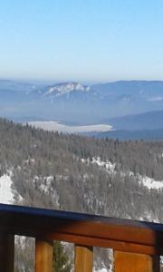 a view of a snow covered mountain in the distance at Ubytovanie Sokolica in Červený Kláštor