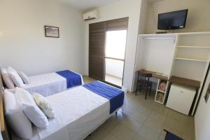 Postel nebo postele na pokoji v ubytování Hotel Porto do Sol