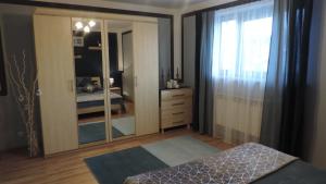 Łóżko lub łóżka w pokoju w obiekcie Apartament Krystyna