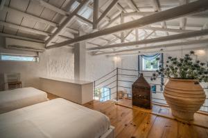 Posteľ alebo postele v izbe v ubytovaní Askos Stone Villa - the Island Panorama