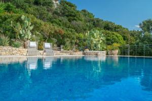 Bazén v ubytovaní Askos Stone Villa - the Island Panorama alebo v jeho blízkosti