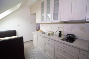 O bucătărie sau chicinetă la Chez moi