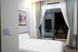 Postel nebo postele na pokoji v ubytování Dalat Memory Inn