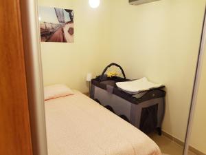 En eller flere senger på et rom på Appartement Costa brava
