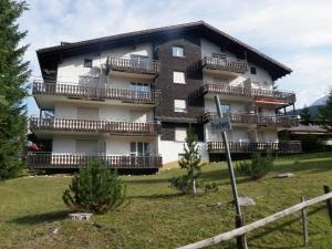 a large building with balconies on the side of it at Damiez (171 Zi) in Lenzerheide