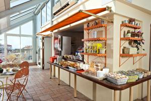 a kitchen with a counter with food on it at L'Esterel in Cannes