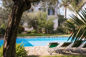Der Swimmingpool an oder in der Nähe von Appartamento in Villa con Giardino privato e piscina
