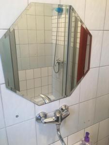 a bathroom with a mirror and a sink at Apartmán Vrchlice in Kutná Hora