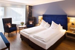 Postel nebo postele na pokoji v ubytování Hotel Menning ***S